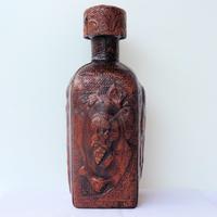 BOTTIGLIA con Don CHISCIOTTE, foderata in cuoio