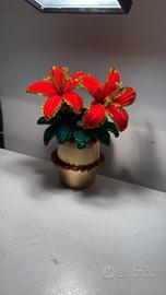 Vaso con fiori natalizi