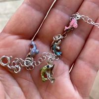 Braccialetto in argento con delfini