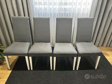 sedie bianche con rivestimento grigio
