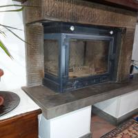 Inserto per caminetto a legna angolare