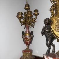 Tris orologio più candelabri