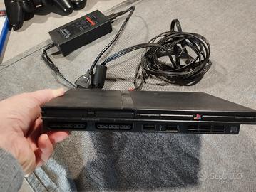 Play Station 2slim+Resident evil out break accesso