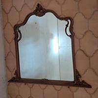 Specchiera antica con cornice lavorata in legno