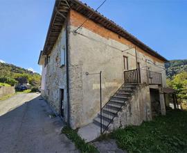 Casa con giardino