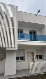 BILOCALE DI NUOVA COSTRUZIONE CON POSTO AUTO A POR