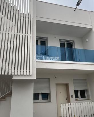 BILOCALE DI NUOVA COSTRUZIONE CON POSTO AUTO A POR