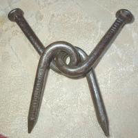 Rompicapo di metallo chiodi intrecciati inizi '900