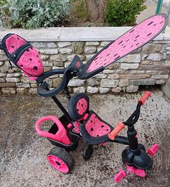 triciclo rosa  e nero per bambine