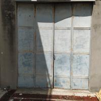 Portone a battente in ferro per garage