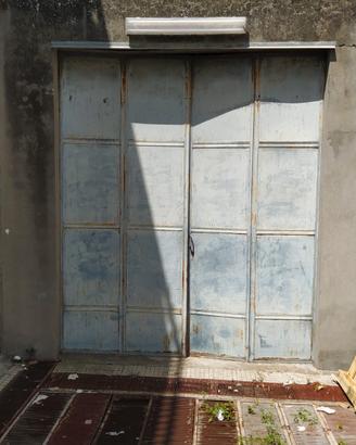 Portone a battente in ferro per garage