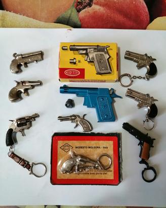 9 pistole vintage giocattolo in miniatura