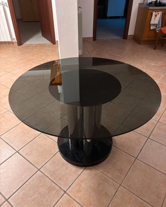 Tavolo rotondo di design in vetro fumé e base in m