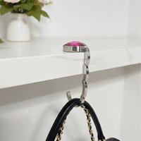 Gancio pieghevole rosa per borsa