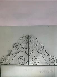 Testata in ferro battuto