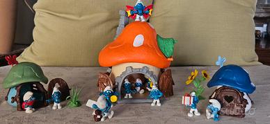 Villaggio dei puffi con casa grande e 2 piccole