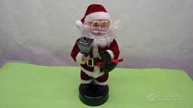 Babbo Natale musicale con lanterna o candela che b