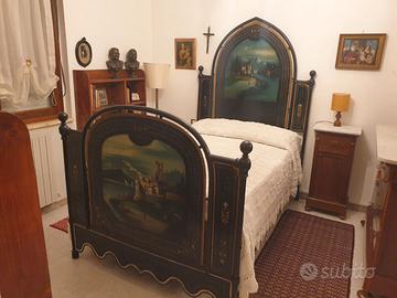 Letto in ferro battuto con decorazioni