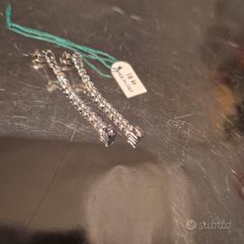 Orecchini in oro bianco a tennis