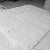 rivestimento in pietra intarsiato a mano