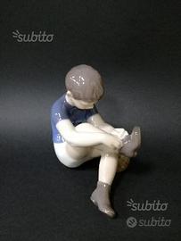 Royal copenaghen boy with ball