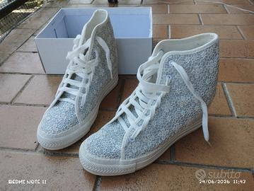 Scarpe con tacco interno. estradà sport