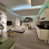 Appartamento con doppio living: indoor-outdoor