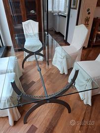 Tavolo di cristallo con basamento in ferro battuto