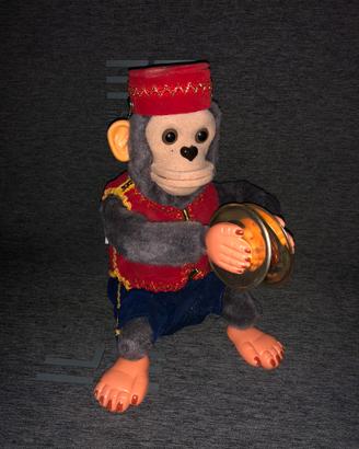 Giocattolo/ciondolo "Mister Monkey" con piatti