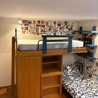 Letto a soppalco con armadio e secondo letto sotto