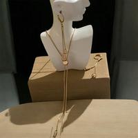 Set collana e orecchini lunghi colore oro