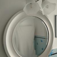 Specchio rotondo bisellato in metallo satinato