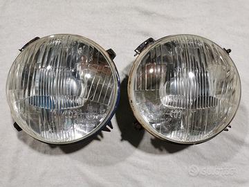 Coppia fari Carello A112 Fiat 850 124 238 1100R