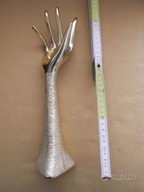 Scultura mano dorata