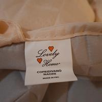 Copridivano beige trapuntato con tasche laterali  