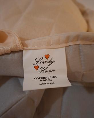 Copridivano beige trapuntato con tasche laterali  