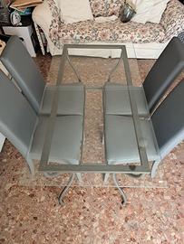 Tavolo in vetro e ferro battuto
