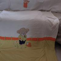 Piumone e paracolpi per culla