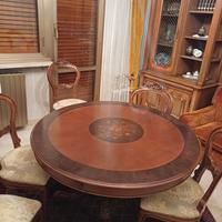 tavolo tondo allungabile con sei sedie