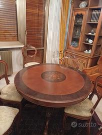 tavolo tondo allungabile con sei sedie