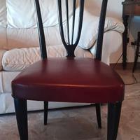 4 sedie in legno laccato nero e sedute in pelle