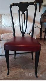 4 sedie in legno laccato nero e sedute in pelle
