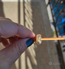 Trollbeads con scatola sui colori ambrati/oro