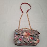 Borsetta marrone e multicolore floreale con catena