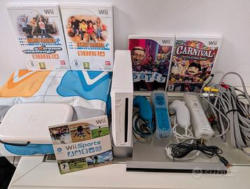 Wii + doppi comandi + tappetino + 5 giochi