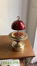 Portasigarette vintage a pianeta con carillon