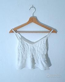 Top bianco con peplo
