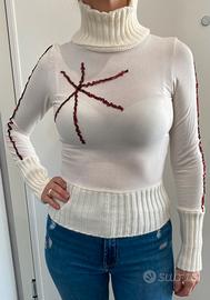 Maglia a collo alto color panna con paillettes