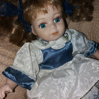 Bambola da collezione occhi blu