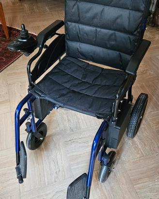 Carrozzina a motore elettrico